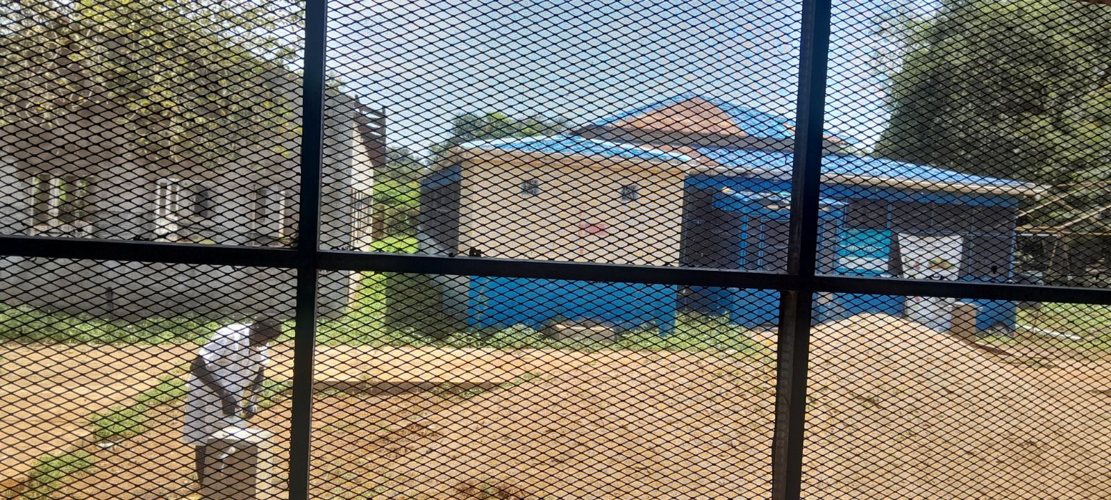 The relief center in Maiwut, South Sudan, seen through a wire fence