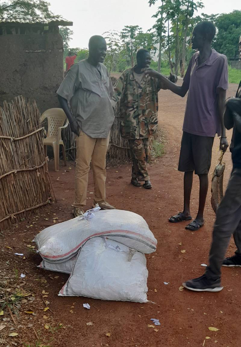 Sacks of RUTF being handed over to community members in South Sudan