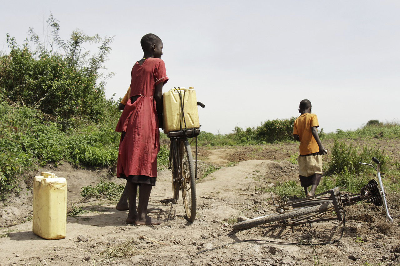 Children in South Sudan collecting water with jerrycans and bicycles