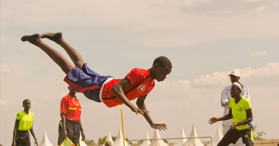 Boruboru player diving through the air during a match in South Sudan